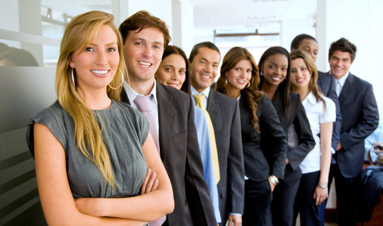 Group of smiling professionals in an office