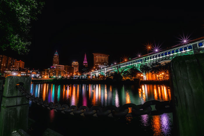 city of Cleveland lit up with multicolored lights at night