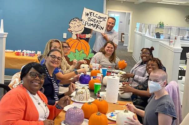 Member Benefits staff painting pumpkins