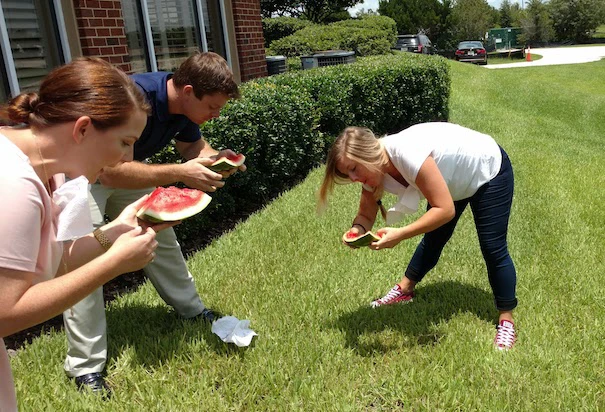 Member Benefits staff eating watermelon outside