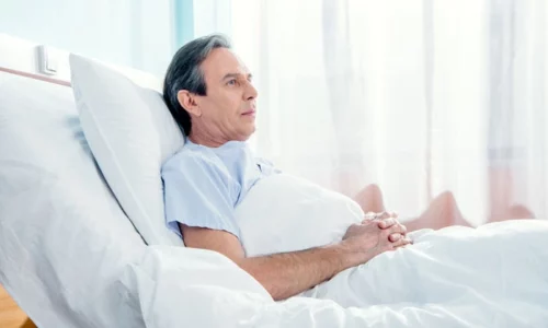 Man In Hospital Bed