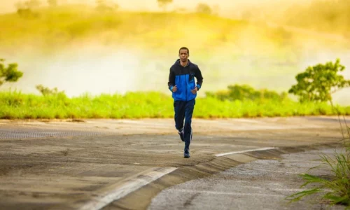 Man Jogging On Empty Road